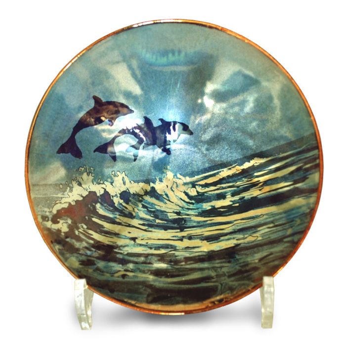 Riding the waves. Silver and purple-blue ground. 16.5 cm diameter. Unique number 7885.